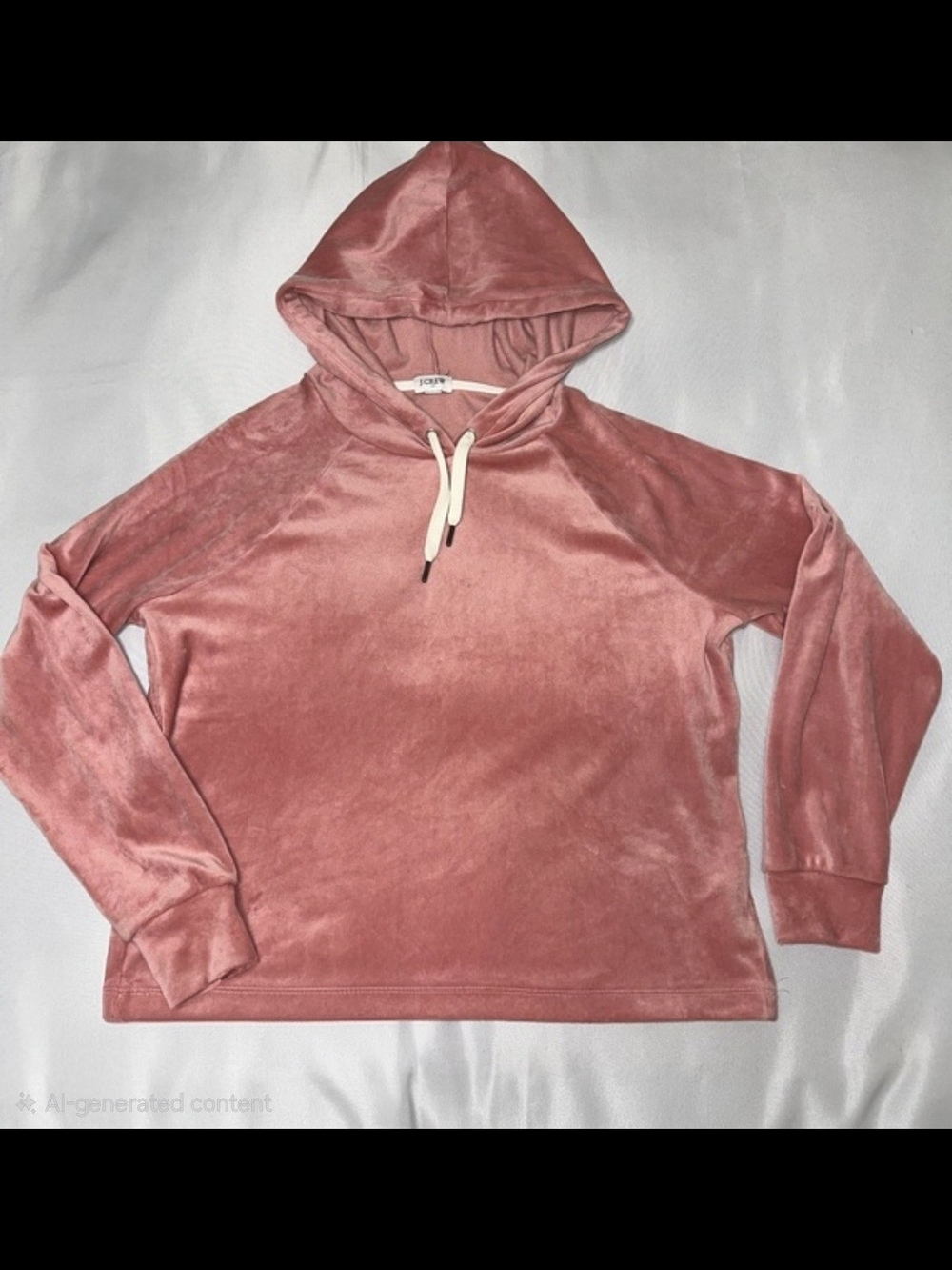 pink J.Crew pullover hoodie features a velvety texture and drawstring hood.